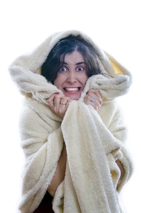 A person who is cold at home.