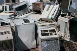 A scrap pile of window AC units.