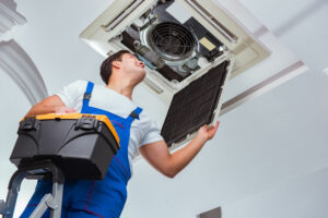 Technician working on Commercial AC Maintenance